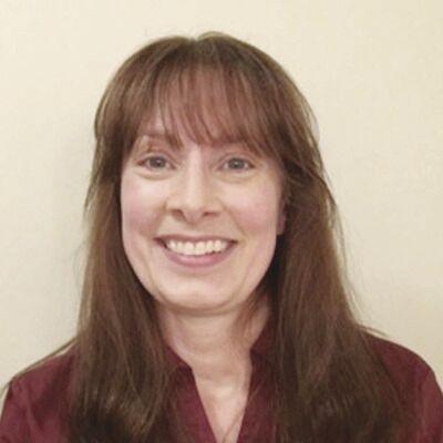 Woman with brown hair smiling