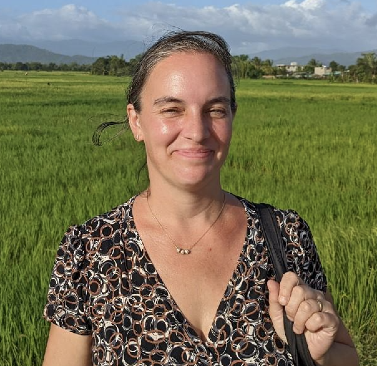 woman in field, smiling