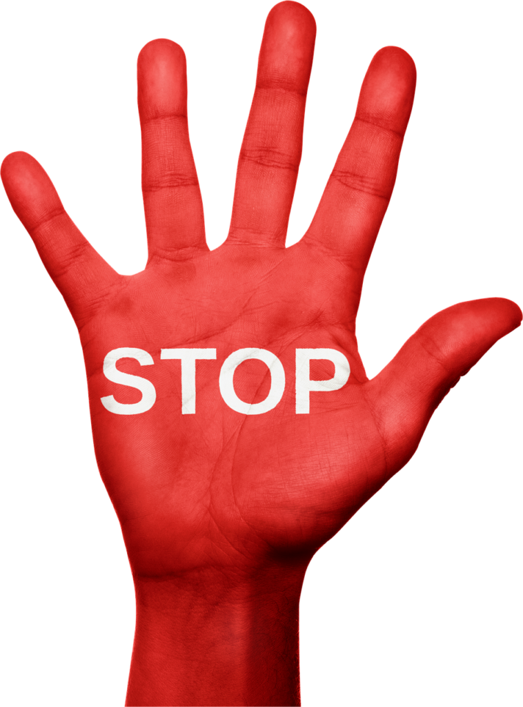 red hand with the word "stop" across the palm