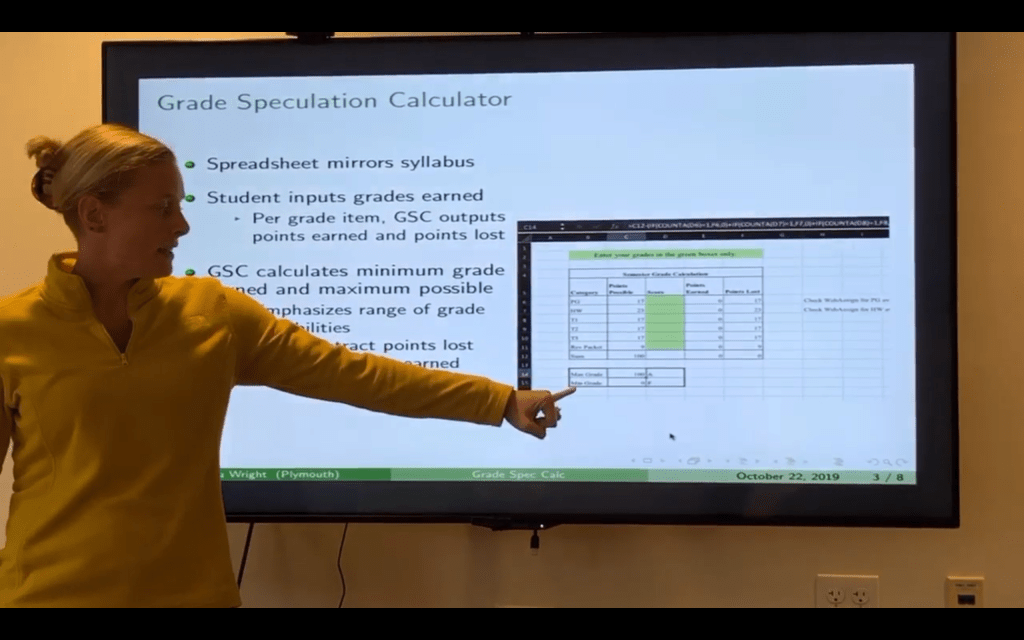 Person presents on the grade speculation calculator.