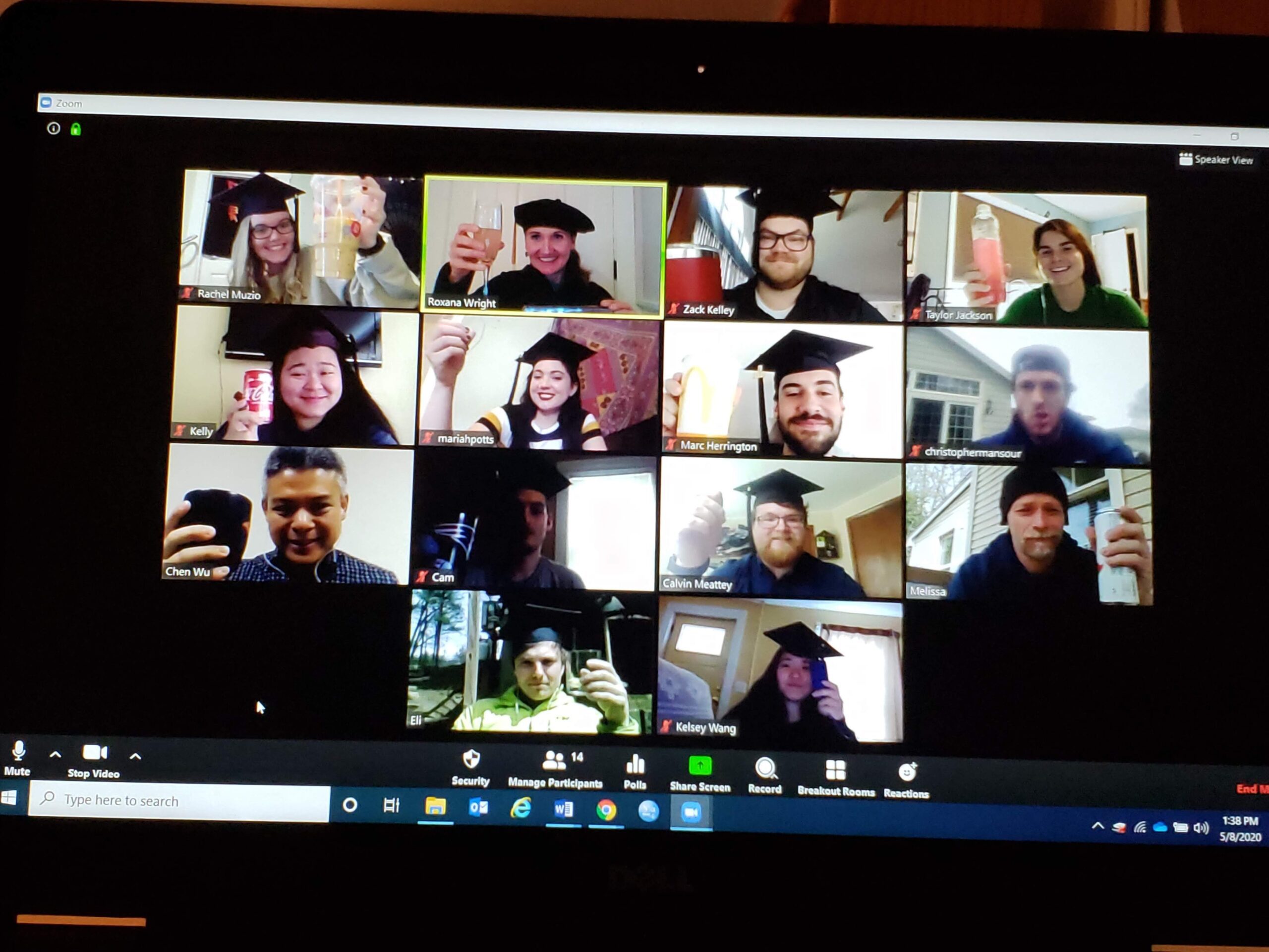 Screenshot of zoom graduation, students making toasts