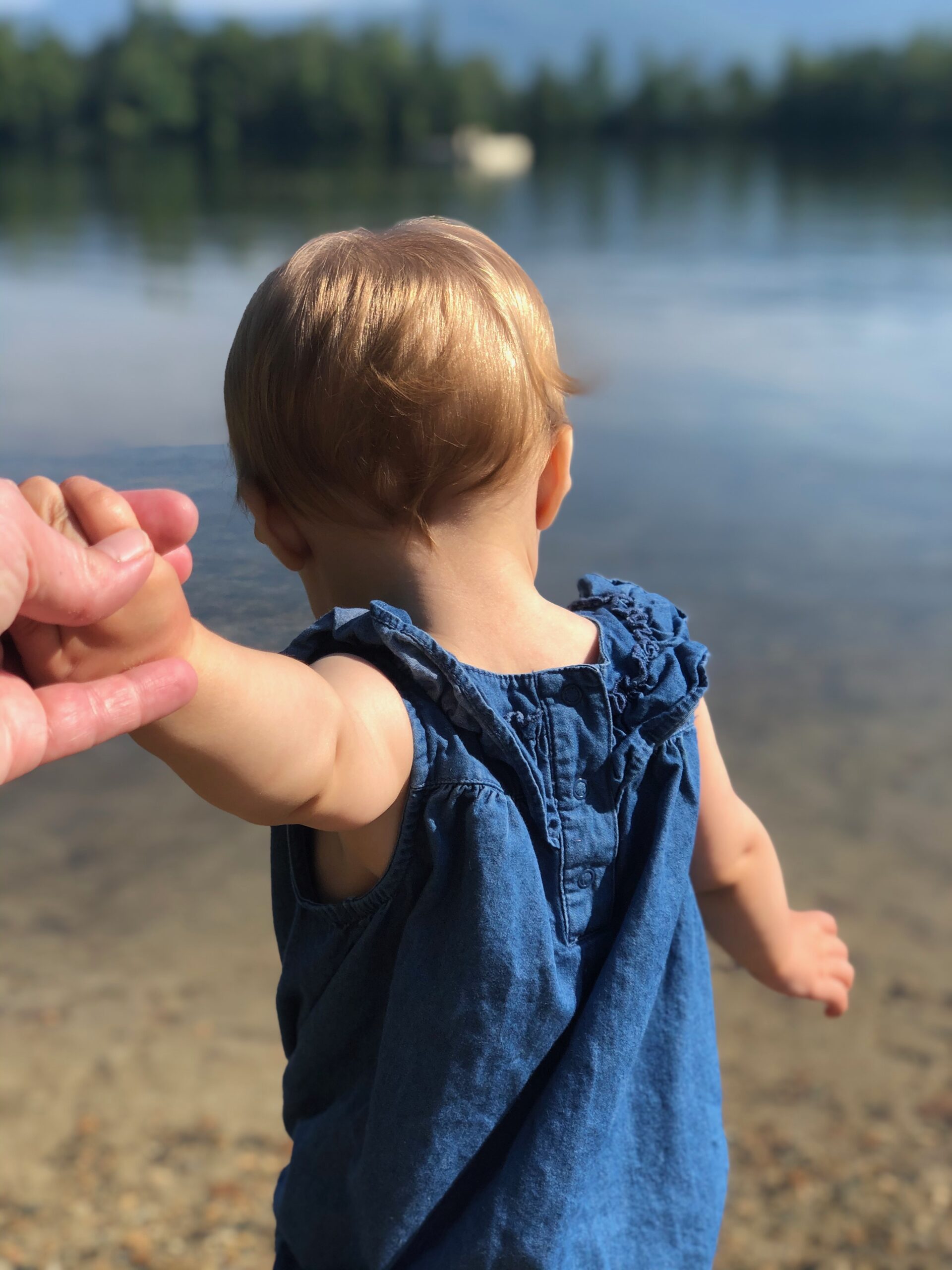 child looking at lake