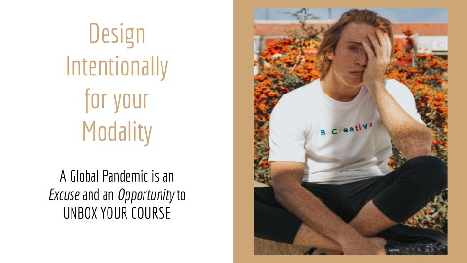 Person with head in hand wearing shirt that says Be Creative