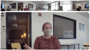 Blond woman in mask talking