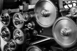 black and white photo of several interconnected gears