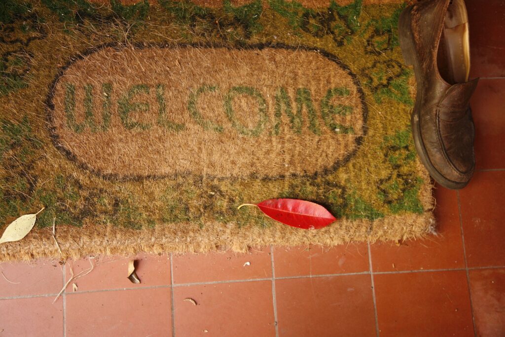 picture of welcome mat on a tile floor