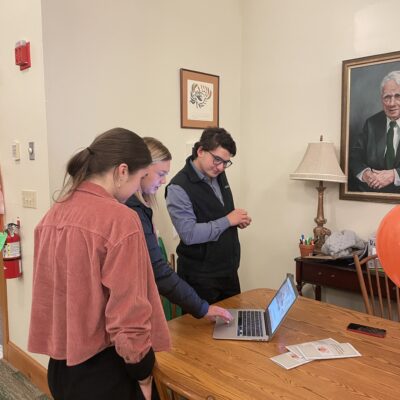 Noah Staple presents at the end of year gathering